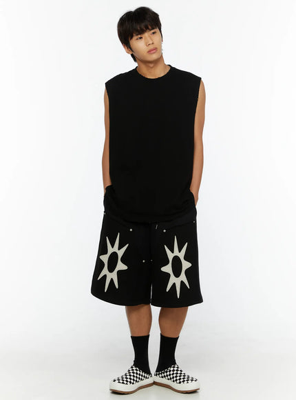 Men's Casual Sleeveless Top IL510 Black full-body front shot on male model hands in pockets, oversized fit with raw-edge hem, sun-appliqué shorts and checkered slip-ons