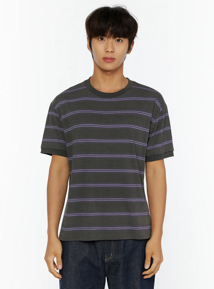 Men's Casual Striped T-Shirt IL515 Purple front close-up shot on model cropped at waist showing charcoal fabric with thin purple horizontal stripes and ribbed cuffs