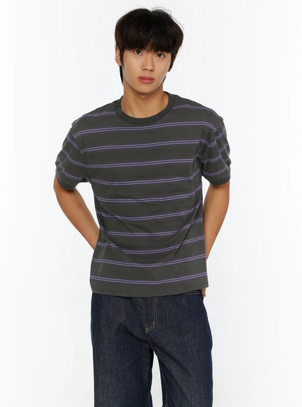 Men's Casual Striped T-Shirt IL515 Purple front crop shot on model hands behind back showing charcoal base with purple horizontal stripe pattern