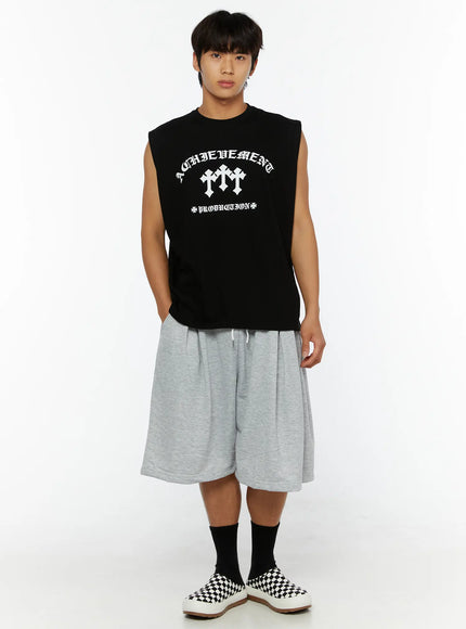 Men's Casual Sweat Shorts IL510 gray full-body front shot on male model in black graphic sleeveless tee, standing straight, styled with black socks and checkered sneakers