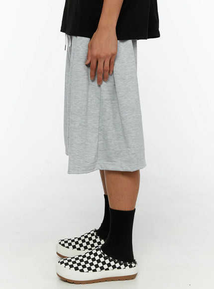 Men's Casual Sweat Shorts IL510 gray side view on male model showing wide-leg drop-crotch silhouette, drawstring waistband, and heathered jersey fabric drape