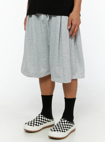 Men's Casual Sweat Shorts IL510 gray angled front close-up on male model showing pleated waistband, white drawstring, and heathered cotton jersey texture