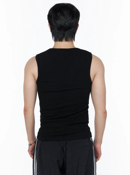 Men's Casual Tank IL502 Black back view on model revealing ribbed knit fabric and fitted cut, paired with striped wide-leg pants