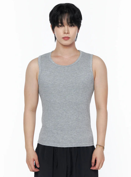 Men's Casual Tank IL502 Gray front view on model standing straight, heather gray ribbed sleeveless tank with fitted body, black pants