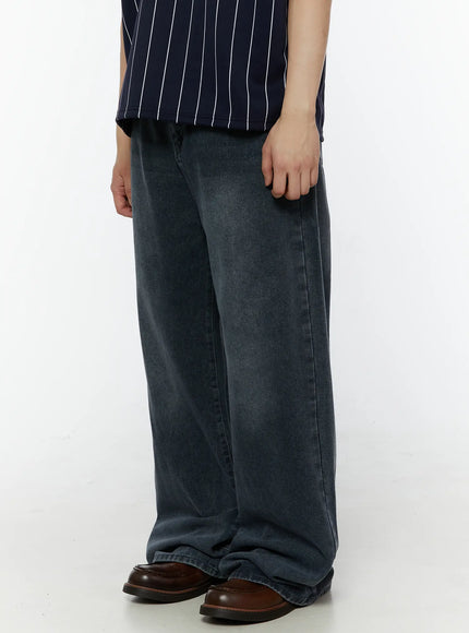 Men's Casual Washed Wide Leg Jeans IL509 Dark blue side view on model revealing straight wide leg cut side seam detail and faded washed denim from hip to hem