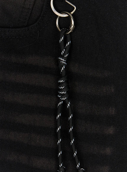 Men's Casual Wide Fit Jorts IL510 Black close-up flat-lay detail of knotted black and white rope charm with silver carabiner ring clipped to front pocket