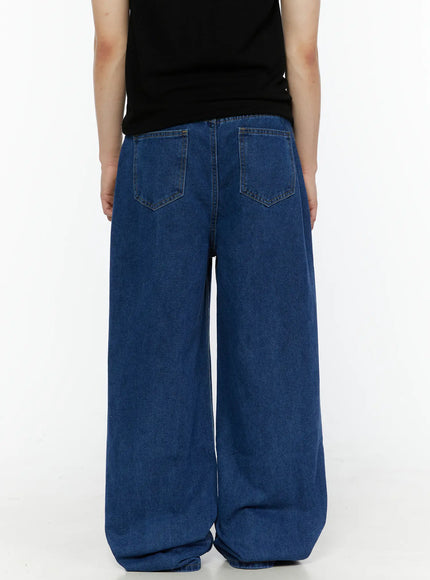 Men's Casual Wide Leg Jeans IL509 Blue back shot on model in black top, showing two back pockets with stitched edges and extra-wide leg hem