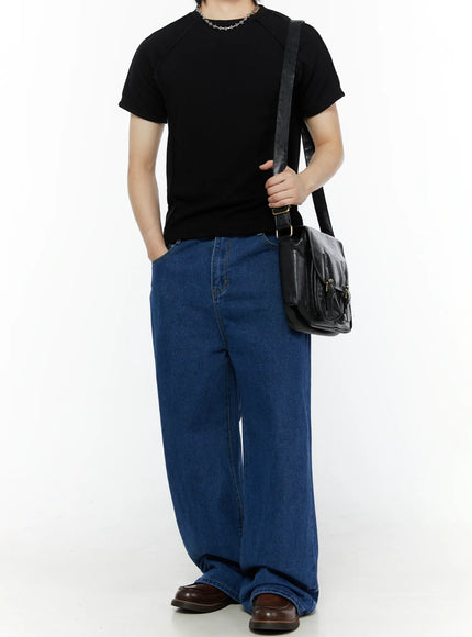 Men's Casual Wide Leg Jeans IL509 Blue full-body front shot on male model styled with black raglan tee, chain necklace, and black leather crossbody bag
