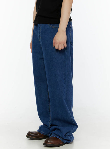 Men's Casual Wide Leg Jeans IL509 Blue side shot on model wearing black top, showing wide-leg silhouette, side seam and front pocket detail