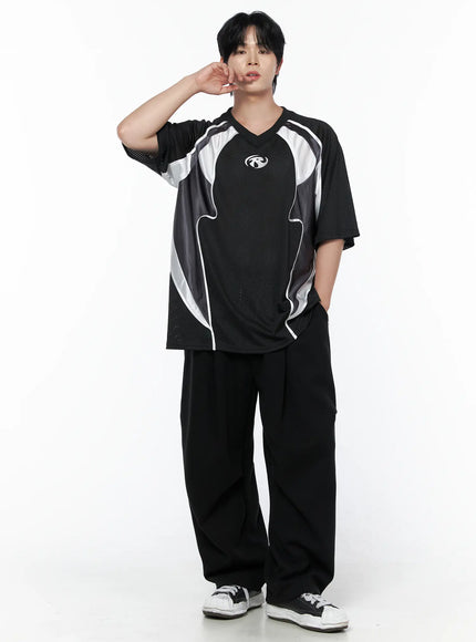 Men's Curved Fit Sweatpants (Black) IL502 black full-length front shot on male model with hand raised styled with athletic mesh jersey and sneakers