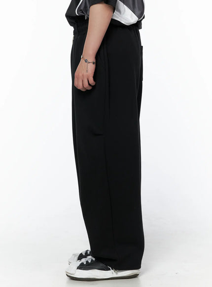 Men's Curved Fit Sweatpants (Black) IL502 black pure side shot on model showing straight wide-leg silhouette and smooth fabric drape from waist to hem