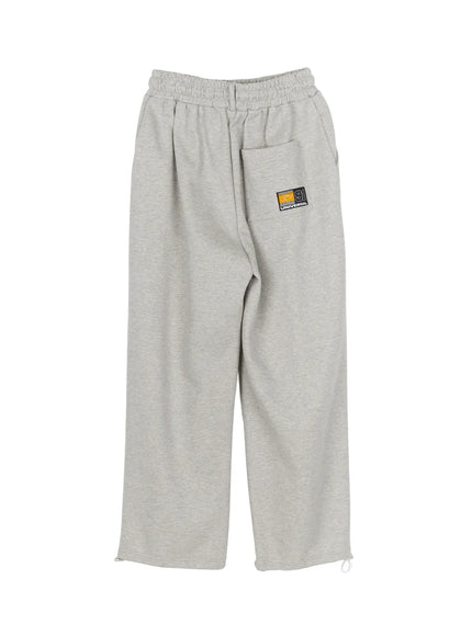 Men's Curved Fit Sweatpants (Gray) IL502 gray flat-lay back view showing GT 91 Universal patch on hip pocket and hem drawcord detail