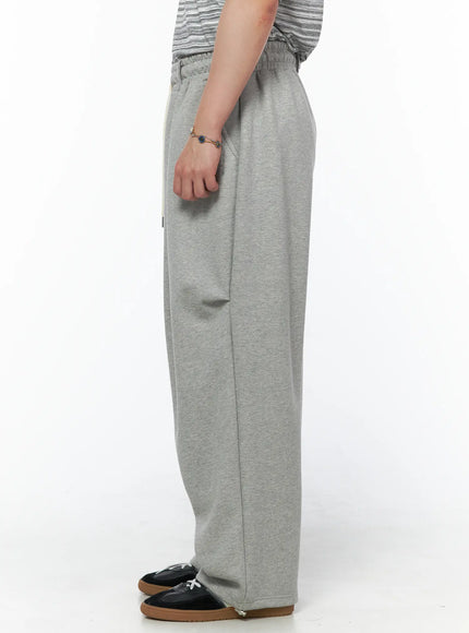 Men's Curved Fit Sweatpants (Gray) IL502 gray pure side crop shot on model highlighting straight wide-leg drop and heathered fleece texture
