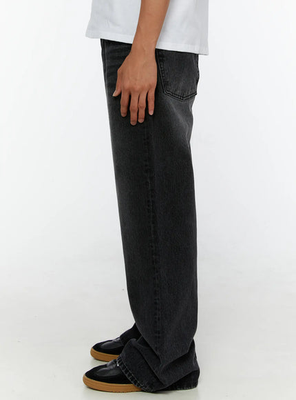 Men's Dark Wash Flare Jeans IL513 Black side profile view on model showing straight silhouette, back pocket stitching, and stacked hem