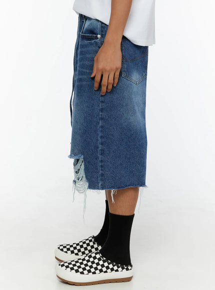 Men's Distressed Jorts IL509 Blue side view on model showing back pocket stitching, straight leg silhouette and frayed distressed hem