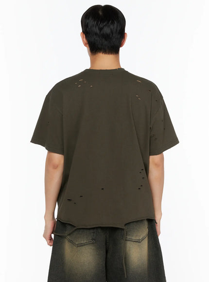 Men's Distressed Tee IL514 Khaki back shot on male model revealing scattered distressed holes across back panel, dropped shoulders