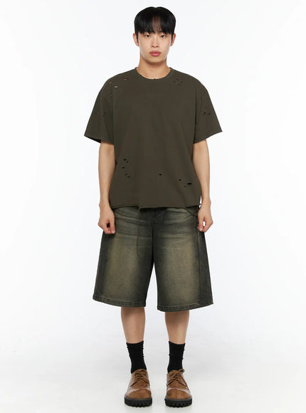 Men's Distressed Tee IL514 Khaki front shot on male model standing straight, scattered distressed holes on cotton fabric, oversized silhouette