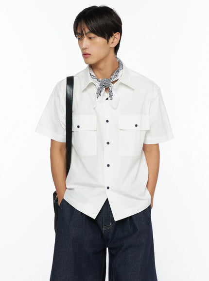 Men's Embroidered Button-Up Shirt IL528 White three-quarter front shot on model with bandana scarf black crossbody strap dual flap pockets looking down
