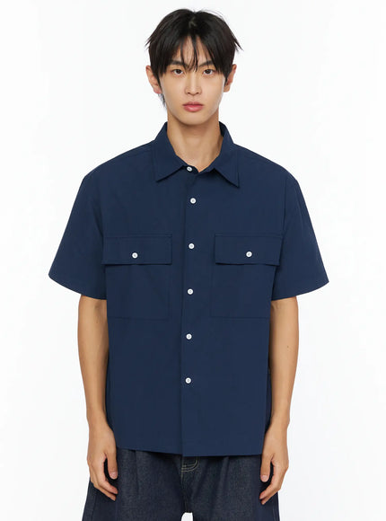 Men's Embroidered Button-Up Shirt IL528 Navy front shot on model showing point collar dual flap chest pockets white buttons and boxy short-sleeve silhouette