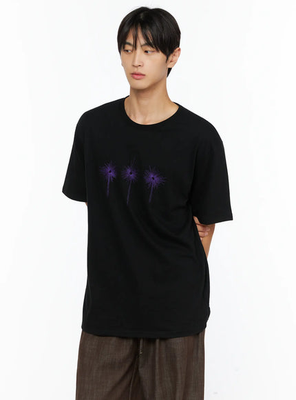 Men's Embroidered Graphic Tee IL528 Black front shot on male model three-quarter pose purple starburst embroidery oversized cotton silhouette