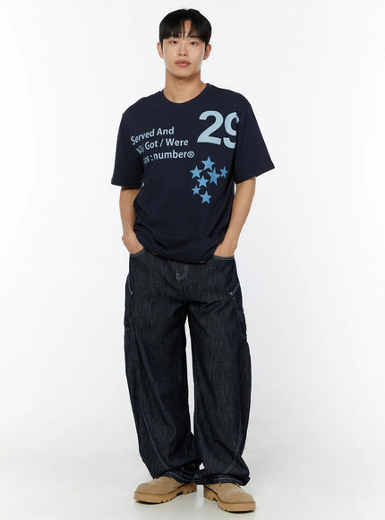 Men's Embroidered Wide Leg Jeans IU529 Dark blue front full-body on male model, hands in pockets, styled with navy 29 star graphic tee and beige chunky boots
