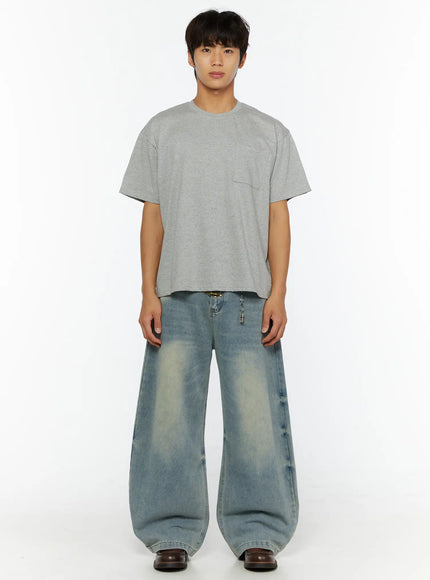 Men's Fireman Clasp Baggy Jeans IL507 Light blue full-body front view on male model styled with gray boxy tee, hands relaxed, showing wide-leg silhouette and faded wash