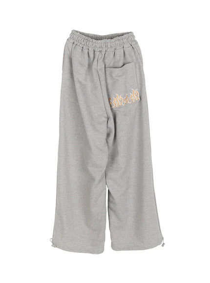 Men's Flame Wide Sweatpants (Gray) IL514 Gray flat-lay back view showing flame embroidered back patch pocket elastic waist and ankle toggle drawcord hem