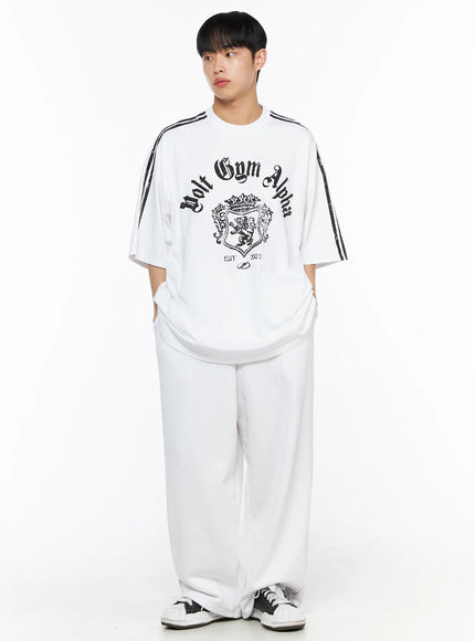 Men's Flame Wide Sweatpants (White) IL514 White front view on male model styled with Volt Gym Alpha graphic tee, elastic drawstring waistband, ultra wide-leg fleece trousers