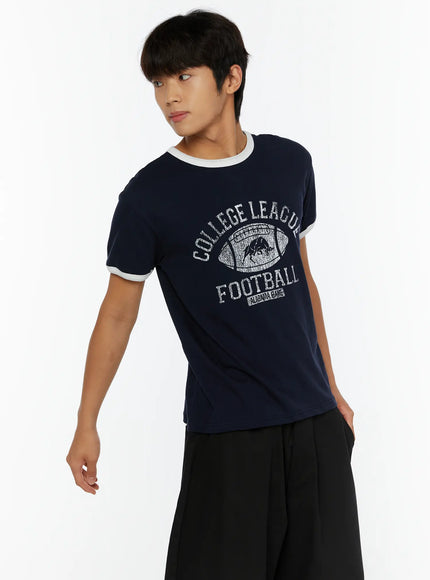 Men's Football Graphic T-Shirt IL513 Dark blue three-quarter side front shot on model gazing away showing distressed football graphic print texture