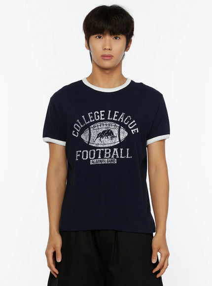 Men's Football Graphic T-Shirt IL513 Dark blue close-up front crop shot on model showing Alabama Game College League Football distressed graphic print