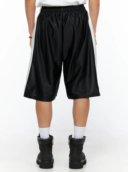 Men's Gothic Print Athletic Shorts IL515 Black back view on model showing clean black satin mesh fabric, white side panels, and elastic smocked waistband