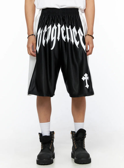 LEWKIN Men's Gothic Print Athletic Shorts IL515 Black front view on model with white gothic Vengeance lettering and cross print, elastic waistband, satin mesh fabric