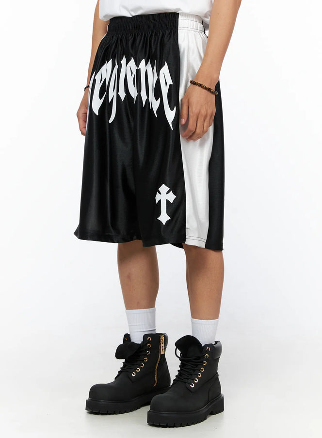 Men's Gothic Print Athletic Shorts IL515 Black angled front view on model showing gothic Vengeance text and white side panel with cross graphic detail