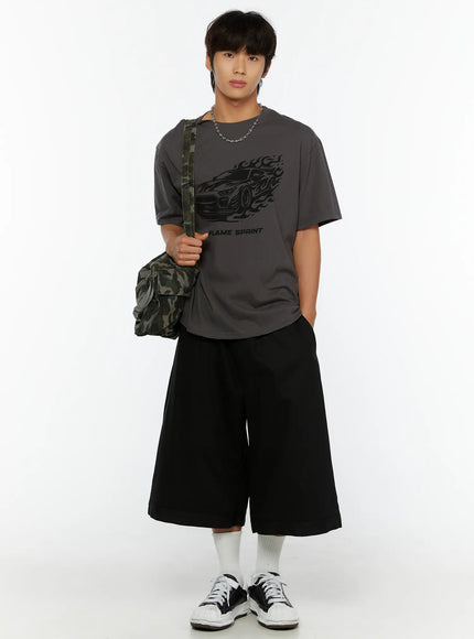 Men's Graphic Car Print T-Shirt IL513 Dark gray full-length front shot on model with camo crossbody bag chain necklace black wide-leg shorts sneakers standing straight