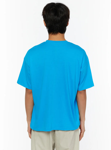 Men's Graphic Chaos T-Shirt IL509 Blue back shot on male model showing plain clean back of oversized crew neck cotton tee with dropped shoulders