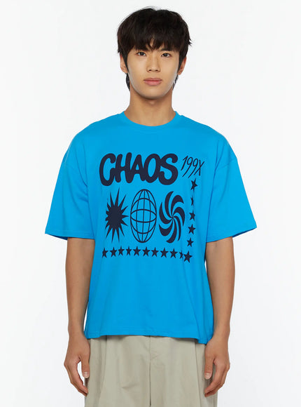 Men's Graphic Chaos T-Shirt IL509 Blue front close-up on male model showing oversized fit and large CHAOS 199X globe star swirl graphic print on chest