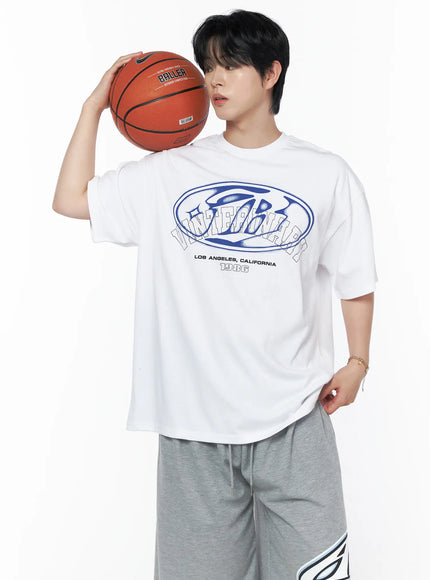 Men's Graphic Oversized T-Shirt IL502 White front shot on male model holding basketball at shoulder, blue oval graphic print, crew neck oversized fit, styled with gray shorts
