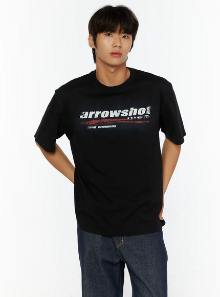 Men's Graphic Oversized T-Shirt IL515 Black front shot on male model hands in pockets styled with dark jeans showing arrowshot distressed graphic print