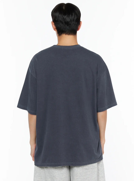 Men's Graphic Oversized Tee IL510 Dark blue back view on male model showing plain oversized silhouette dropped shoulders and washed cotton texture