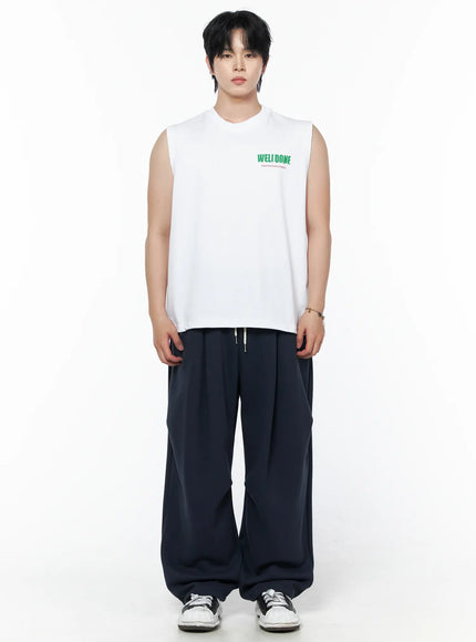 Men's Graphic Print Sleeveless Tee IL502 White front shot on male model standing straight arms at sides styled with navy wide-leg pants