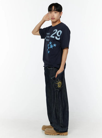LEWKIN Men's Graphic Print T-Shirt IU529 Navy side shot on male model with hand raised, featuring bold 29 numeral and star print, styled with dark denim