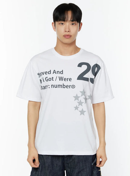 Men's Graphic Print T-Shirt IU529 White front close-up shot on male model showing grey 29 numeral, Served And All Got Were Stars:number® text and grey star cluster print