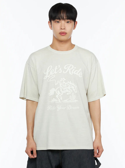 Men's Graphic Print Tee IL510 Light beige front close-up upper-body shot on male model showing Let's Ride Ride Your Dream cowboy graphic on chest