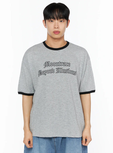 Men's Graphic Ringer T-Shirt IL510 Gray front cropped shot on male model showing Moontrace Beyond Illusions gothic chest print with black contrast ringer collar and cuffs