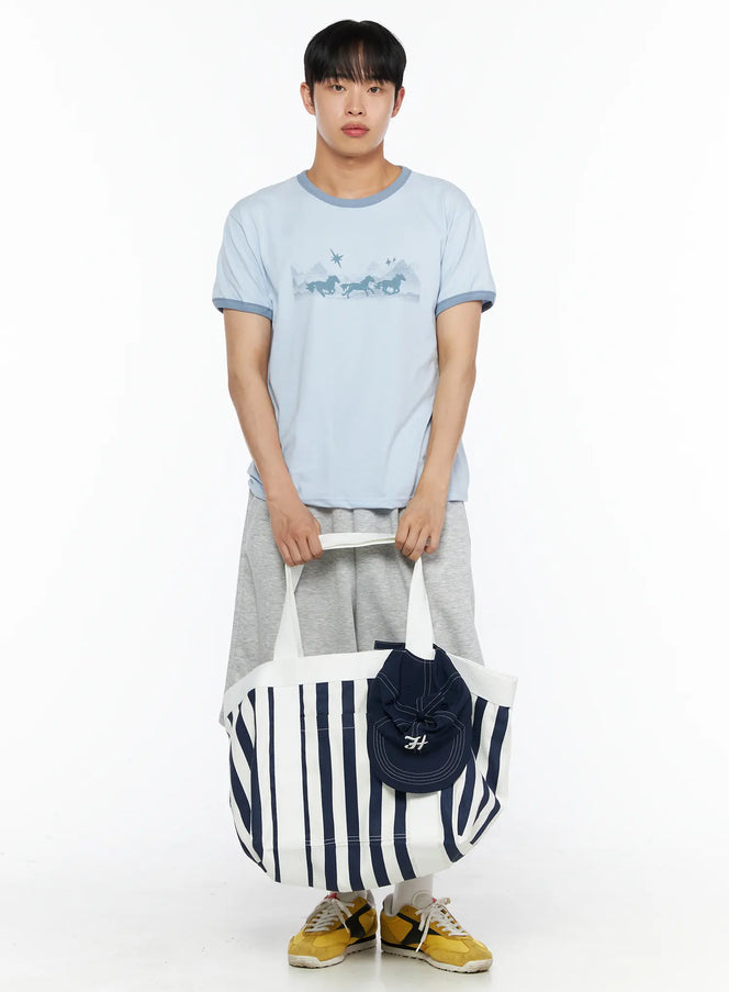 LEWKIN Men's Graphic Ringer Tee IL514 Light blue S/M full-body front shot on male model holding striped tote bag, horse print, contrast teal trim