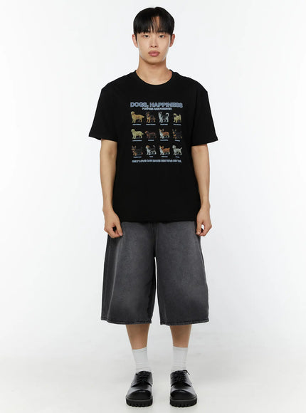 Men's Graphic Round Neck T-Shirt IU529 Black full-body front shot on male model standing straight styled with washed grey wide-leg denim shorts white socks and black shoes