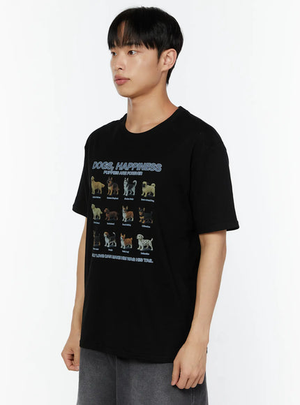 Men's Graphic Round Neck T-Shirt IU529 Black side shot on male model looking away showing Dogs Happiness puppy breed graphic print and relaxed boxy fit short sleeves