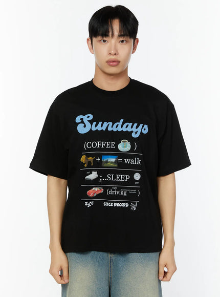 Men's Graphic Short Sleeve T-Shirt IU529 Black close-up front shot on male model showing Sundays blue script graphic with COFFEE SLEEP driving print
