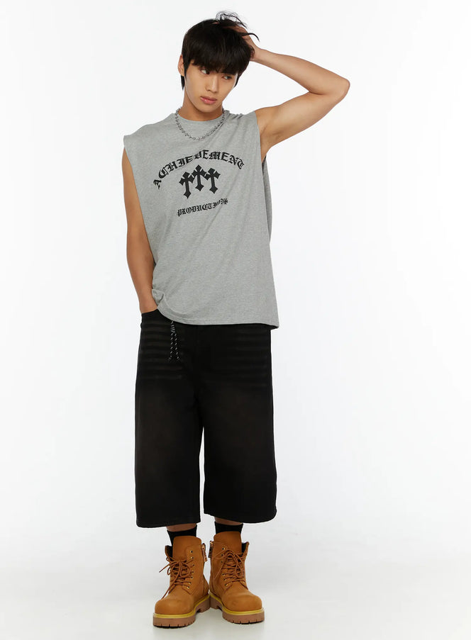 LEWKIN Men's Graphic Sleeveless Tee IL510 Gray size M/L front shot on male model with hand behind head styled with black wide-leg shorts and tan boots