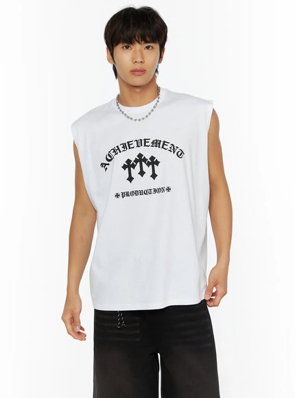 Men's Graphic Sleeveless Tee IL510 White front close-up on male model wearing chain necklace showing ACHIEVEMENT triple cross PRODUCTION old English graphic print